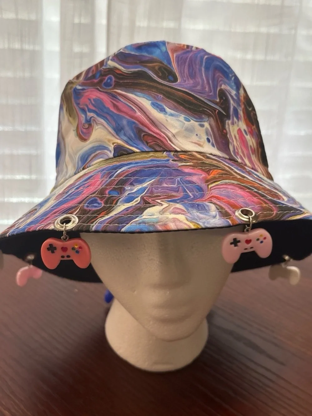 Multicolor Swirl Bucket Hat with Pink Game Controller Charms
